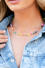 Load image into Gallery viewer, Infused on an invisible wire, an assortment of multicolored beads, acrylics, and chiseled stones alternating with dainty silver rods coalesce around the neckline for a youthful pop of color. Features an adjustable clasp closure. As the stone elements in this piece are natural, some color variation is normal.  Sold as one individual necklace. Includes one pair of matching earrings.

