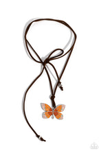 Load image into Gallery viewer, Featuring an ombre effect of baby pink to coral to Burnt Orange and accents of tiffany, a vivacious oversized butterfly flutters at the bottom of a knotted lengthened strand of brown suede for a wanderlust statement. Features an adjustable sliding bead closure.  Sold as one individual necklace. Includes one pair of matching earrings.
