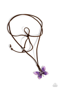 Featuring an ombre effect of lavender to purple to plum and accents of Leek Green, a vivacious oversized butterfly flutters at the bottom of a knotted lengthened strand of brown suede for a wanderlust statement. Features an adjustable tie closure.  Sold as one individual necklace. Includes one pair of matching earrings.