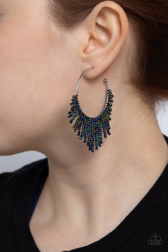 Cascading strands of oil spill seed beads stream out from the bottom of a classic silver hoop, resulting in a flirtatiously tasseled look. Earring attaches to a standard post fitting. Hoop measures approximately 1 1/2