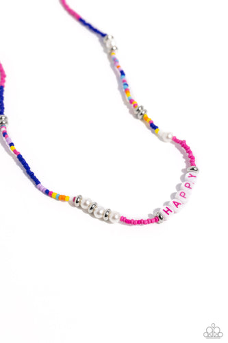 Infused along an invisible string, white pearls, multicolored seed beads, silver accents, and white beads spelling out the word 