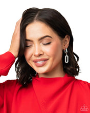 Load image into Gallery viewer, Two oversized links, one a sleek silver, the other embellished with a blinding collection of white rhinestones, coalesces into a luxurious lure as it sways from the ear. Earring attaches to a standard clip-on fitting.  Sold as one pair of clip-on earrings.
