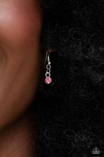 Load image into Gallery viewer, Small pink rhinestone hanging from a silver fish hook earring.
