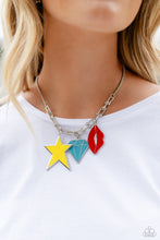 Load image into Gallery viewer, A strand of gleaming silver popcorn chain leads the eye down to a collection of silver horseshoe-like strands that coalesce below the collar. Attached to the horseshoe fittings, an oversized yellow star, turquoise diamond, and red lip charm add a youthful pop of color to the design for a trendy finish. Features an adjustable clasp closure.  Sold as one individual necklace. Includes one pair of matching earrings.
