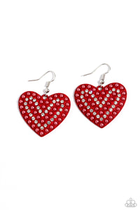 A red-painted heart is covered in rows of tiny white rhinestones and red pearls, emitting radiant shimmer as it swings from the ear. Earring attaches to a standard fishhook fitting. Sold as one pair of earrings.