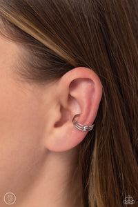 A trio of thin, sleek silver bars arc around the ear to create a trendy, adjustable, one-size-fits-all cuff. A solitaire silver stud dots the center of the layered display for additional eye-catching detail.  Sold as one pair of cuff earrings.
