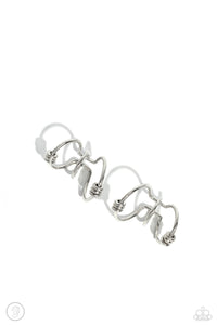 A collection of dainty silver discs haphazardly dot across a trio of airy, dainty silver bars that curve around the ear to create an adjustable, one-size-fits-all cuff.  Sold as one pair of cuff earrings.