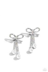Adorned in sparkling iridescent rhinestones, high-sheen bands of silver curl and loop into a stunning bow charm, creating a classy statement at the ear. Iridescent rhinestones encased in scalloped silver fittings, featuring white pearls that slowly increase in size dangle from the bow charm adding a refined tassel to the stunning display. Earring attaches to a standard post fitting.  Sold as one pair of post earrings.