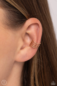 Row after row of dainty, flat gold bars arc across the ear, coalescing into an adjustable, one-size-fits-all stacked cuff that demands attention.  Sold as one pair of cuff earrings.