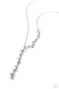 Featuring pronged fittings, a collection of baby pink square-cut, heart, oval, round, and teardrop gems cascade down the neckline in a diagonal pattern, creating an intense, incandescent statement piece. Features an adjustable clasp closure.  Sold as one individual necklace. Includes one pair of matching earrings.