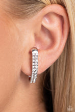 Load image into Gallery viewer, Two rows of glassy white rhinestones are set along the center of a curved silver bar for a refined display of dazzle. Features a sleek surface for sliding ability to desired position on the ear. Due to its structure, adjusting capability is limited.  Sold as one pair of illusion post earrings.
