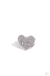 Brushed in a glittery iridescent finish, a gray heart frame rests atop airy silver bands for a retro glamorous look. The word "kind" is centered atop the heart frame for an optimistic finish. Features a stretchy band for a flexible fit.  Sold as one individual ring.