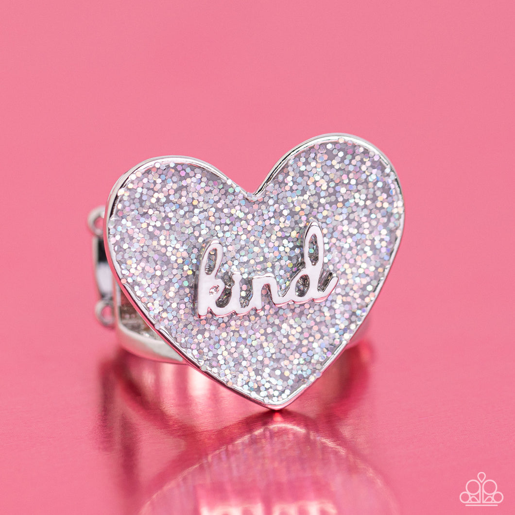 Brushed in a glittery iridescent finish, a gray heart frame rests atop airy silver bands for a retro glamorous look. The word 