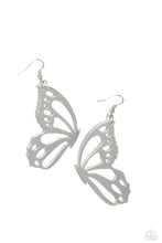 Load image into Gallery viewer, Splashed in a metallic silver hue, an oversized butterfly wing with airy cutout details dangles from the ear, creating a whimsically colorful sight. Earring attaches to a standard fishhook fitting.  Sold as one pair of earrings.
