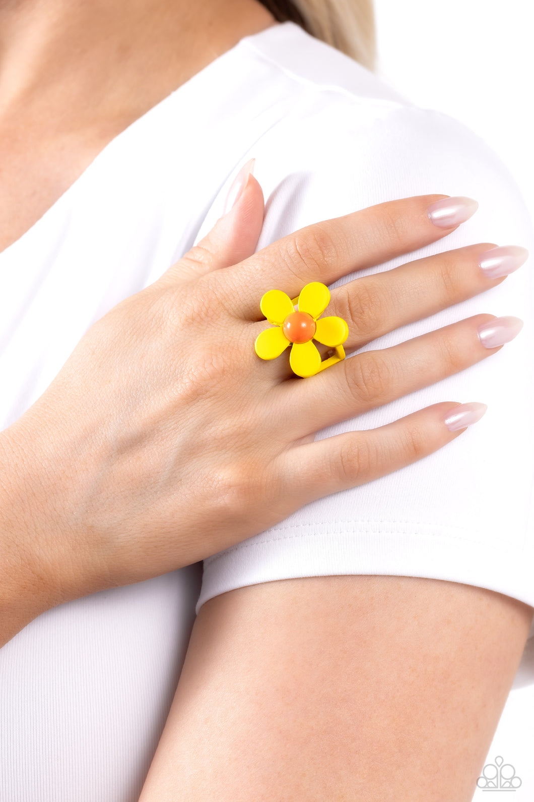 Featuring an orange center, yellow-painted petals bloom atop airy yellow bands, coalescing into a colorful floral centerpiece. Features a stretchy band for a flexible fit.   Featured inside The Preview at Made for More! Sold as one individual ring.