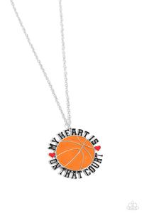 Dangling from an extended dainty silver chain, an oversized orange-painted basketball pendant features the phrase "My Heart is on that Court" in all caps and black lettering as it wraps around the ball. Red-painted hearts separate "My heart is" from "on that Court" for a sport-loving-inspired finish. Features an adjustable clasp closure.  Sold as one individual necklace. Includes one pair of matching earrings.