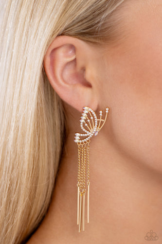Featuring dainty white rhinestones and dainty marquise-cut iridescent gems, a thin, elongated, airy gold butterfly is titled to the side as if about to take off in flight. A collection of dainty gold rods swings from dainty gold chain tassels at the bottom of the whimsical frame for some free-falling movement. Earring attaches to a standard post fitting. Due to its prismatic palette, color may vary.  Sold as one pair of post earrings. 