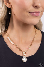 Load image into Gallery viewer, Featuring an elegant lariat closure, an oversized, baroque white pearl cascades from the bottom of a gold paperclip chain for a refined fashion. Dainty, glossy baroque pearl beads are infused along one side of the gold chain for an additional touch of abstract sheen to the charming design.  Sold as one individual necklace. Includes one pair of matching earrings.
