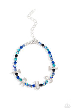 Load image into Gallery viewer, Set in silver square fittings, various multicolored rhinestones gleam around the wrist. Infused along the design, sleek silver letters spell out the word &quot;TRUST&quot; for an inspirational finish. Features an adjustable clasp closure. Due to its prismatic palette, color may vary.  Sold as one individual bracelet.
