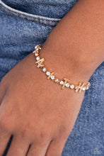 Load image into Gallery viewer, Set in gold square fittings, various multicolored rhinestones gleam around the wrist. Infused along the design, sleek gold letters spell out the word &quot;FAITH&quot; for an inspirational finish. Features an adjustable clasp closure. Due to its prismatic palette, color may vary.  Sold as one individual bracelet.
