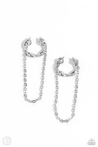 A glistening silver bar delicately twists into a dainty hoop while a solitaire shimmery silver chain cascades below it, creating an adjustable refined, one-size-fits-all display.  Sold as one pair of cuff earrings.