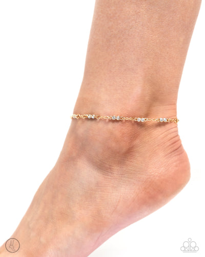Infused along a classic chain, duos of white gems pressed in circular gold fittings glisten around the ankle for a simplistic shimmer. Features an adjustable clasp closure. Sold as one individual anklet.