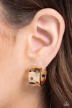 Load image into Gallery viewer, Featuring star silhouettes, a thick gold hoop snugly curls around the ear for a stellar display. Earring attaches to a standard hinge closure fitting. Hoop measures approximately 3/4&quot; in diameter. Sold as one pair of hoop earrings.

