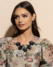 Load image into Gallery viewer, Featuring silver stud centers, a collection of 3D black leather flowers connect to a classic silver chain for a ruggedly retro look. Features an adjustable clasp closure. Sold as one individual necklace. Includes one pair of matching earrings.
