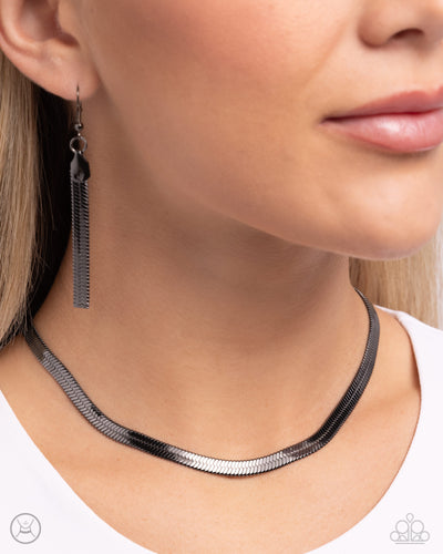Featuring a sleek gunmetal finish, a herringbone chain loops below the collar for a bold basic. Features an adjustable clasp closure. Sold as one individual choker necklace. Includes one pair of matching earrings.