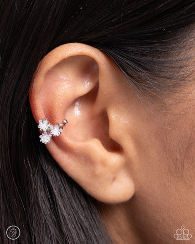 Featuring white rhinestones, a trio of silver stars twinkles from the ear for a stellar, adjustable, one-size-fits-all cuff.  Sold as one pair of cuff earrings.