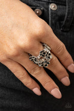 Load image into Gallery viewer, A whimsical collection of glassy black beads and shiny white floral frames dot three shimmery silver bands across the finger, coalescing into a colorful centerpiece. Features a stretchy band for a flexible fit. Sold as one individual ring.
