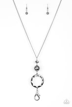 Load image into Gallery viewer, A faceted gunmetal bead, an oversized gunmetal bead, and a hammered gunmetal hoop swing from the bottom of an elongated gunmetal chain for an edgy look. A lobster clasp hangs from the bottom of the design to allow a name badge or other item to be attached. Features an adjustable clasp closure.    Sold as one individual lanyard. Includes one pair of matching earrings.
