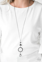 Load image into Gallery viewer, A faceted gunmetal bead, an oversized gunmetal bead, and a hammered gunmetal hoop swing from the bottom of an elongated gunmetal chain for an edgy look. A lobster clasp hangs from the bottom of the design to allow a name badge or other item to be attached. Features an adjustable clasp closure.    Sold as one individual lanyard. Includes one pair of matching earrings.
