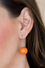 Load image into Gallery viewer, Orange wooden bead dangling from a silver fish hook earring.
