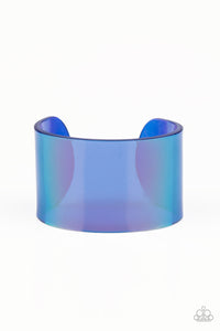 Featuring a holographic shimmer, a thick blue acrylic cuff wraps around the wrist for a retro inspired fashion.  Sold as one individual bracelet.