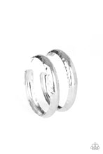 Load image into Gallery viewer, A thick piece of silver has been heavily hammered and delicately curved into a dramatically handcrafted hoop. Earring attaches to a standard post fitting. Hoop measures approximately 2 ½” in diameter.  Sold as one pair of hoop earrings.
