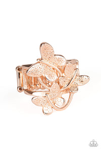 A trio of fluttering rose gold butterflies rest atop the finger, coalescing into a whimsical centerpiece. Features a stretchy band for a flexible fit.    Sold as one individual ring.