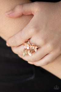 A trio of fluttering rose gold butterflies rest atop the finger, coalescing into a whimsical centerpiece. Features a stretchy band for a flexible fit.    Sold as one individual ring.