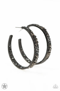 The front facing surface of a chunky black hoop is dipped in brilliantly sparkling hematite rhinestones while light-catching texture wraps around the back. The interior of the hoop features the opposite pattern, creating the illusion of a full hoop of blinding Blockbuster shimmer. Earring attaches to a standard post fitting. Hoop measures 1 3/4" in diameter.  Sold as one pair of hoop earrings.