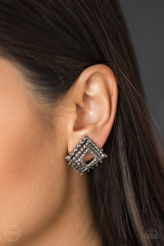Gradually increasing in size, glittery hematite rhinestones are encrusted along three stacking gunmetal frames for a regal look. The square frames slightly curve in towards the ear for an edgy finish. Earring attaches to a standard clip-on fitting. Sold as one pair of clip-on earrings.