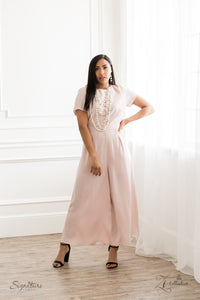 An elegant collection of timeless white pearls, shiny sections of silver chain, and bedazzling white rhinestone encrusted silver beads effortlessly cascade down the chest. The vintage inspired layers drape into breathtaking rows of radiance, resulting in an irresistible collision of romance. Features an adjustable clasp closure.