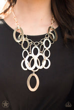 Load image into Gallery viewer, Large gold links and shimmering textured gold rings cascade below a gold chain freely, allowing for movement that makes a bold statement. Features an adjustable clasp closure. Sold as one individual necklace with matching earrings.

