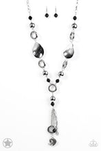 Load image into Gallery viewer, Long chain of black crystalized beads, curved plates of silver with a pearly finish, and chunky silver rings lead down to a tassel of chains and charms, including a crescent moon and a heart.  Sold as one individual blockbuster necklace with matching earrings.
