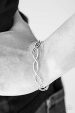 Load image into Gallery viewer, Brushed in a glistening finish, shimmery silver bars crisscross across the wrist, creating a dainty cuff for a refined look.  Sold as one individual bracelet.
