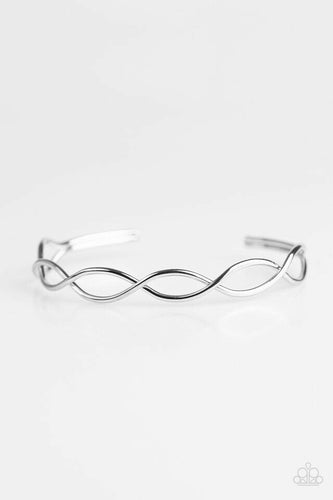 Brushed in a glistening finish, shimmery silver bars crisscross across the wrist, creating a dainty cuff for a refined look.  Sold as one individual bracelet.